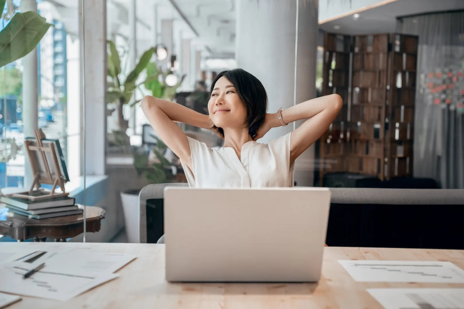 Employee taking a mindful break at a desk which showcases workplace wellness and stress relief