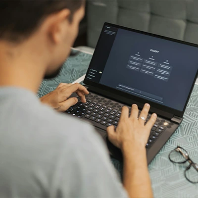 Person using AI software on a laptop